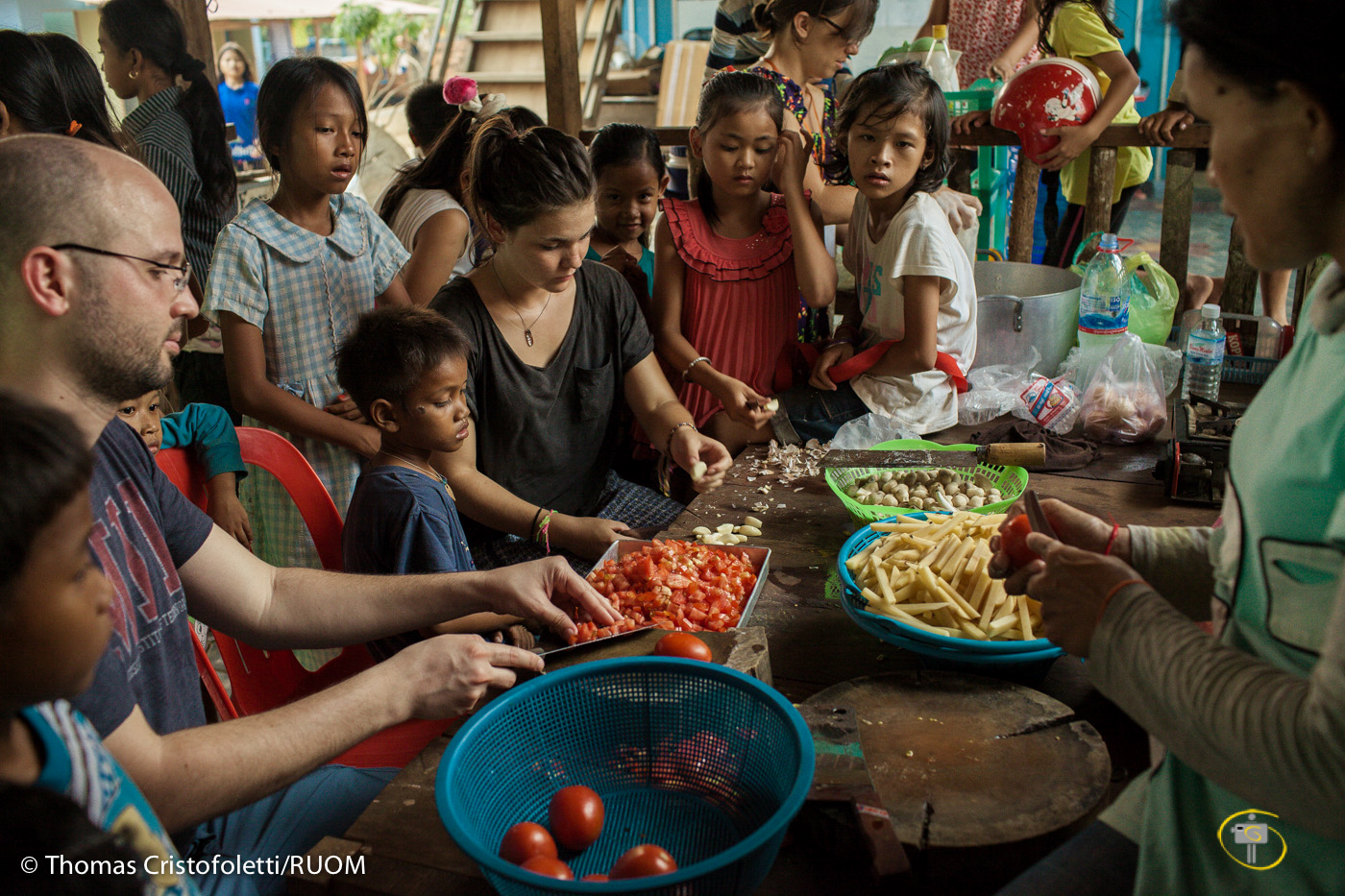 05/04/2013 - Siem Reap (Cambodia). Volunteer prepare food for the kids in a orphanage in the outskirt of Siem Reap. Despite the good intentions, most short-term volunteers lack experience in dealing with institutionalised children. © Thomas Cristofoletti 2013